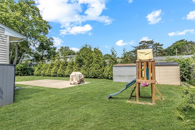 51 Andrews Ave, Wyandanch, NY 11798 - view of green lawn with a shed, a playground, and a patio