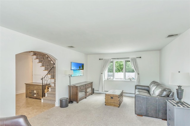 721 3rd Ave, East Northport, NY 11731 - living room with arched walkways, stairway, baseboard heating, and a baseboard heating unit