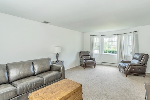 721 3rd Ave, East Northport, NY 11731 - carpeted living room with a baseboard heating unit and baseboards