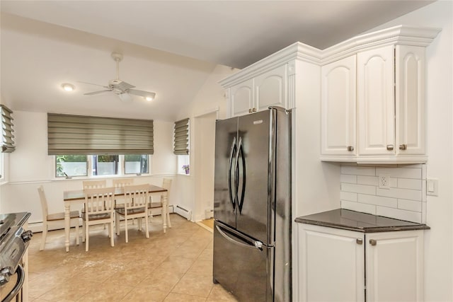 721 3rd Ave, East Northport, NY 11731 - kitchen featuring freestanding refrigerator, a ceiling fan, white cabinetry, light tile patterned flooring, and lofted ceiling
