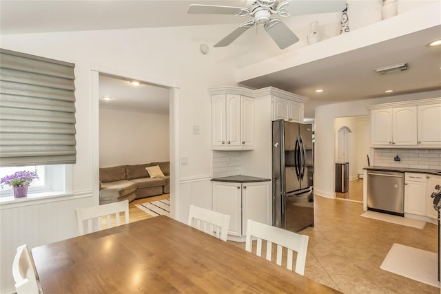 721 3rd Ave, East Northport, NY 11731 - unfurnished dining area with a ceiling fan, light tile patterned floors, a wainscoted wall, and recessed lighting