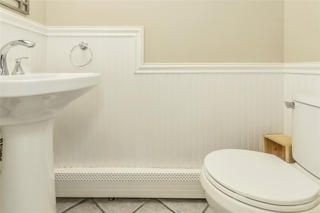721 3rd Ave, East Northport, NY 11731 - bathroom featuring toilet, wainscoting, tile patterned floors, and a baseboard heating unit
