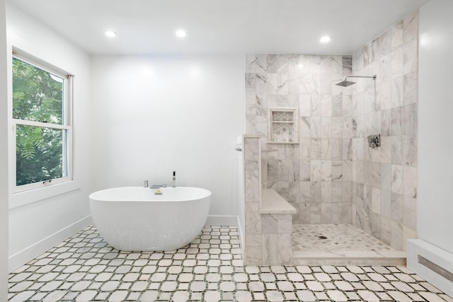 full bath with walk in shower, recessed lighting, a freestanding bath, and baseboards
