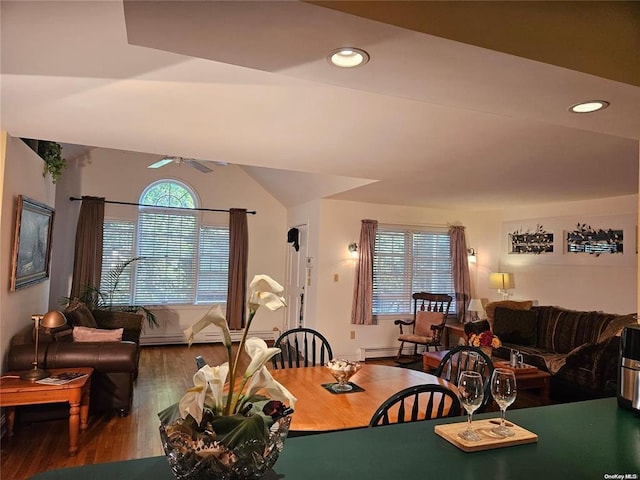 dining space featuring wood finished floors, ceiling fan, lofted ceiling, and recessed lighting
