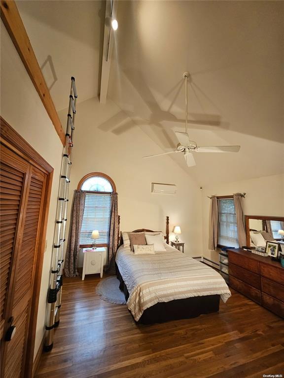 bedroom featuring dark wood-style flooring, beam ceiling, ceiling fan, and high vaulted ceiling
