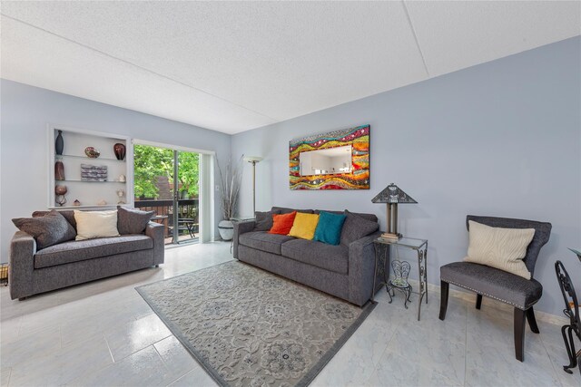 71-28 Sutton Pl Unit 3, Flushing, NY 11365 - living area featuring a textured ceiling