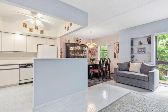 71-28 Sutton Pl Unit 3, Flushing, NY 11365 - kitchen with white appliances, white cabinetry, a chandelier, and plenty of natural light