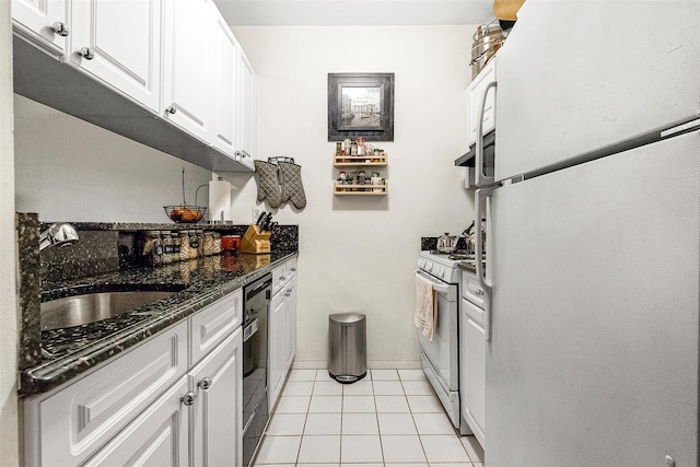 87-30 62nd Ave Unit 202, Rego Park, NY 11375 - kitchen featuring white appliances, white cabinetry, a sink, light tile patterned floors, and baseboards