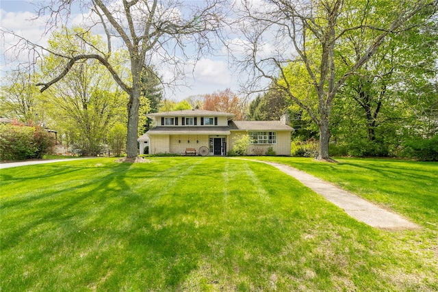 63 Wright Blvd, Hopewell Junction, NY 12533 - view of front facade featuring a front lawn and a chimney