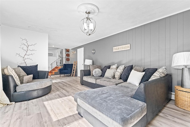 63 Wright Blvd, Hopewell Junction, NY 12533 - living room with stairs, wood finished floors, a baseboard heating unit, and a chandelier