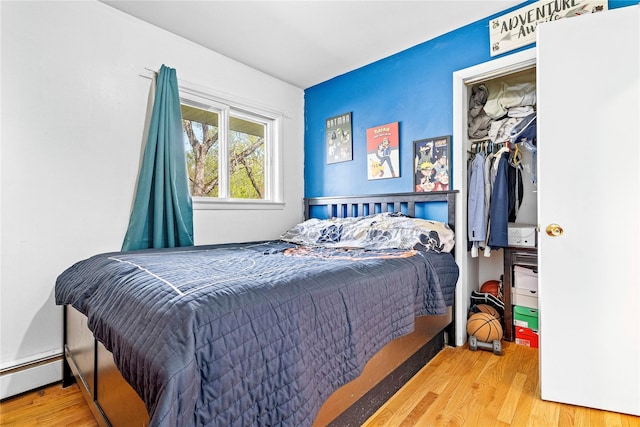 63 Wright Blvd, Hopewell Junction, NY 12533 - bedroom featuring wood finished floors and a baseboard heating unit