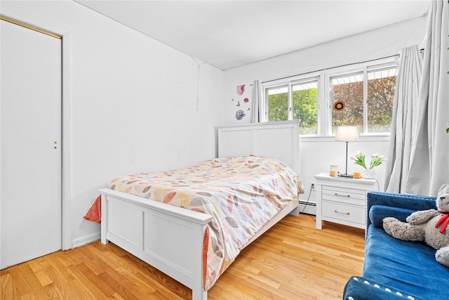 63 Wright Blvd, Hopewell Junction, NY 12533 - bedroom with wood finished floors and a baseboard heating unit