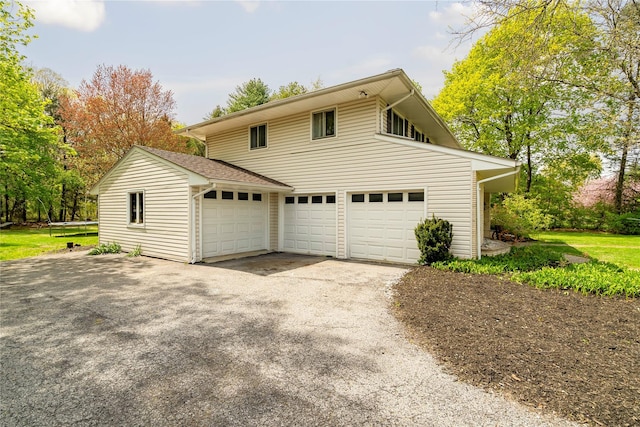 63 Wright Blvd, Hopewell Junction, NY 12533 - view of side of home with a garage