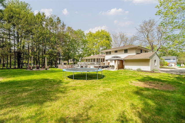 63 Wright Blvd, Hopewell Junction, NY 12533 - view of grassy yard with a trampoline and a gazebo