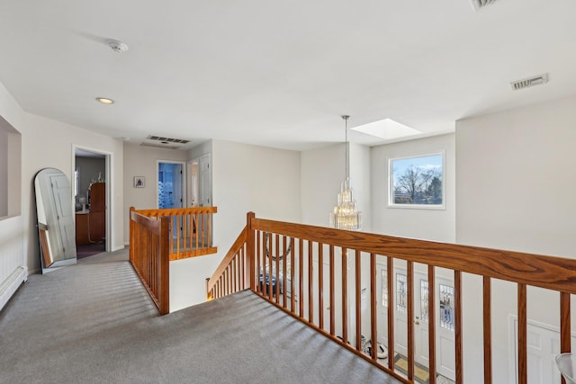 1 Deforest Ct, West Nyack, NY 10994 - hallway featuring an upstairs landing, a skylight, carpet floors, recessed lighting, and a chandelier