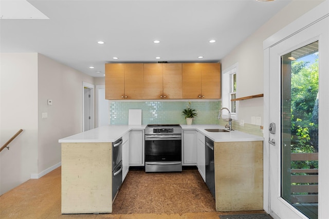 2 Mountain View Pl N, New Paltz, NY 12561 - kitchen with stainless steel appliances, a sink, a peninsula, recessed lighting, and light countertops