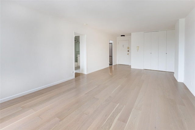 2500 Johnson Ave Unit 3B, Bronx, NY 10463 - unfurnished living room featuring light wood-type flooring and baseboards