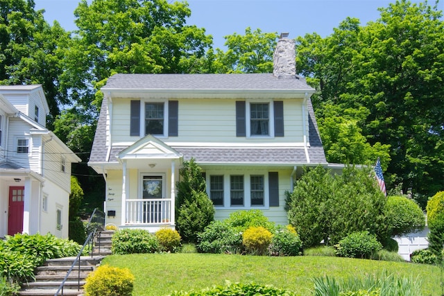 238 Read Ave, Tuckahoe, NY 10707 - view of front of home with a chimney, roof with shingles, and a front yard