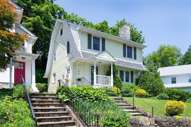 238 Read Ave, Tuckahoe, NY 10707 - view of front of house with stairway, a chimney, covered porch, and a shingled roof