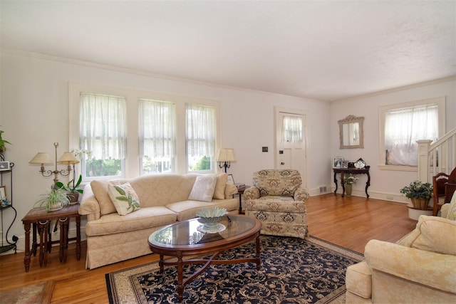 238 Read Ave, Tuckahoe, NY 10707 - living room with light wood finished floors, healthy amount of natural light, and ornamental molding