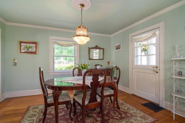 238 Read Ave, Tuckahoe, NY 10707 - dining space featuring healthy amount of natural light, crown molding, baseboards, and wood finished floors