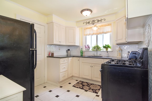238 Read Ave, Tuckahoe, NY 10707 - kitchen featuring black appliances, decorative backsplash, a sink, dark countertops, and crown molding