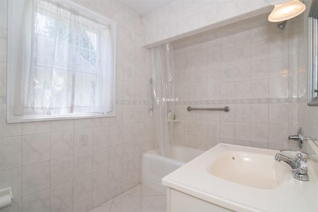 238 Read Ave, Tuckahoe, NY 10707 - bathroom with tile walls, shower / bath combination with curtain, a sink, and marble finish floors