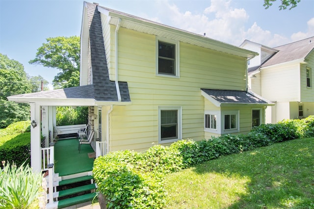 238 Read Ave, Tuckahoe, NY 10707 - back of property featuring roof with shingles and a lawn