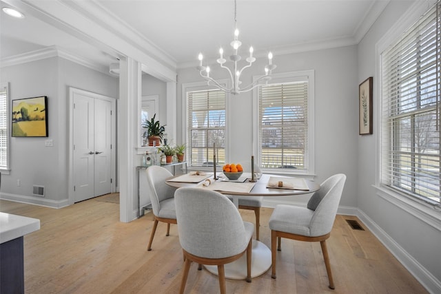 6 Livingston St, Red Hook, NY 12571 - dining room with light wood-style flooring, plenty of natural light, a chandelier, ornamental molding, and baseboards