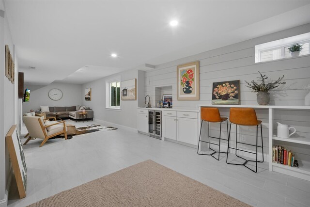 6 Livingston St, Red Hook, NY 12571 - living room featuring bar area, beverage cooler, recessed lighting, and baseboards