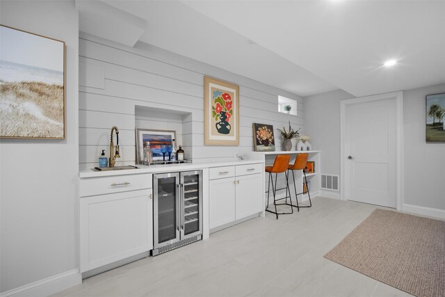 6 Livingston St, Red Hook, NY 12571 - indoor wet bar with beverage cooler, baseboards, and wood walls