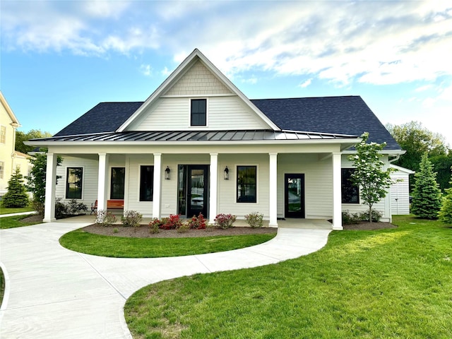 6 Livingston St, Red Hook, NY 12571 - modern inspired farmhouse with a standing seam roof, a porch, a front lawn, roof with shingles, and metal roof