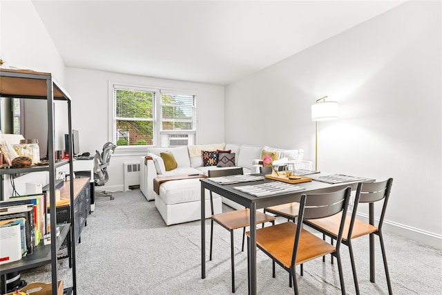 5 Bryant Cres Unit 1B, White Plains, NY 10605 - dining area with radiator heating unit, baseboards, and light carpet