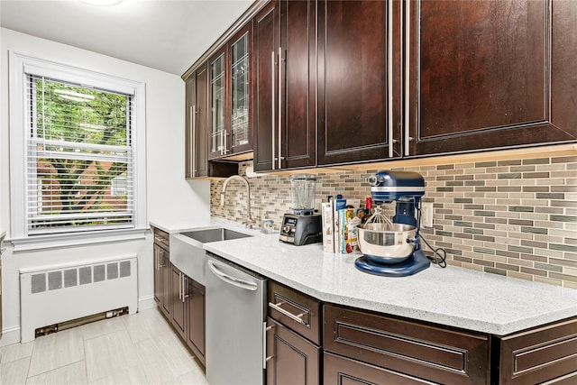 5 Bryant Cres Unit 1B, White Plains, NY 10605 - kitchen with radiator heating unit, stainless steel dishwasher, dark brown cabinets, glass insert cabinets, and light stone counters