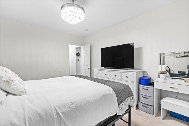 5 Bryant Cres Unit 1B, White Plains, NY 10605 - bedroom with light colored carpet and a chandelier