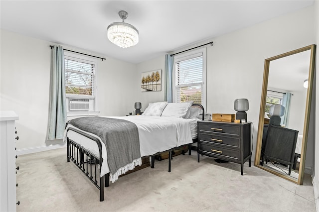 5 Bryant Cres Unit 1B, White Plains, NY 10605 - bedroom featuring multiple windows, a chandelier, carpet, and cooling unit