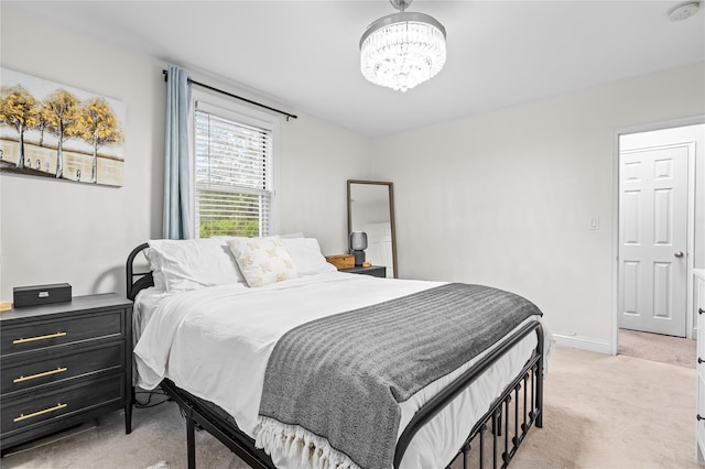 5 Bryant Cres Unit 1B, White Plains, NY 10605 - bedroom with light carpet, a chandelier, and baseboards
