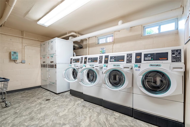 5 Bryant Cres Unit 1B, White Plains, NY 10605 - communal laundry room with concrete block wall, stacked washer / dryer, and washing machine and clothes dryer