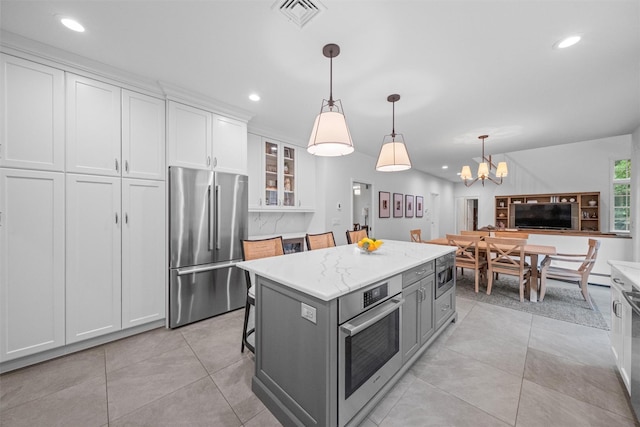 56 Londonderry Ln, Somers, NY 10589 - kitchen featuring stainless steel appliances, white cabinetry, a chandelier, recessed lighting, and glass insert cabinets