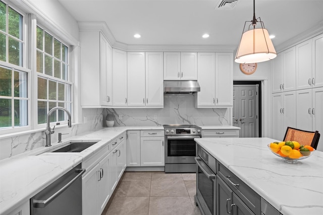 56 Londonderry Ln, Somers, NY 10589 - kitchen featuring under cabinet range hood, stainless steel appliances, a sink, white cabinets, and recessed lighting