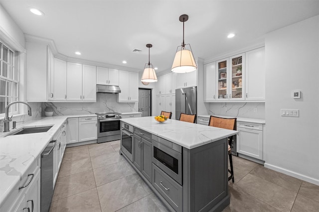 56 Londonderry Ln, Somers, NY 10589 - kitchen featuring a sink, stainless steel appliances, white cabinetry, tasteful backsplash, and recessed lighting