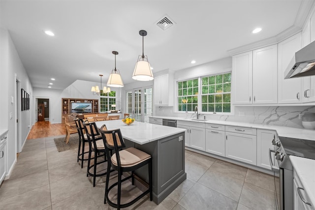56 Londonderry Ln, Somers, NY 10589 - kitchen with stainless steel appliances, a sink, recessed lighting, backsplash, and white cabinetry