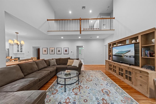 56 Londonderry Ln, Somers, NY 10589 - living area with a towering ceiling, a chandelier, light wood-type flooring, and recessed lighting