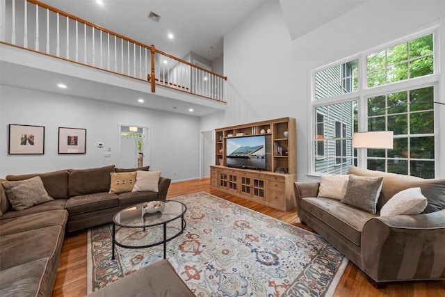 56 Londonderry Ln, Somers, NY 10589 - living room featuring high vaulted ceiling, wood finished floors, and recessed lighting