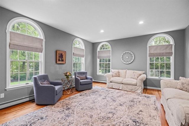 56 Londonderry Ln, Somers, NY 10589 - living room with a baseboard heating unit, recessed lighting, a baseboard radiator, and wood finished floors