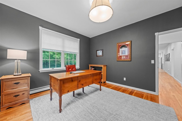 56 Londonderry Ln, Somers, NY 10589 - office area featuring a baseboard radiator, light wood-style floors, and baseboards