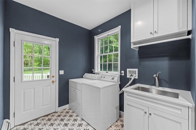 56 Londonderry Ln, Somers, NY 10589 - laundry area featuring separate washer and dryer, cabinet space, baseboards, light flooring, and a baseboard radiator