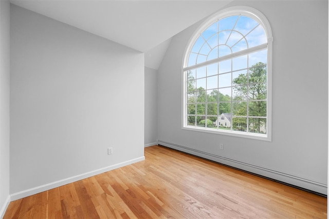 56 Londonderry Ln, Somers, NY 10589 - spare room with a baseboard heating unit, wood finished floors, lofted ceiling, and baseboards