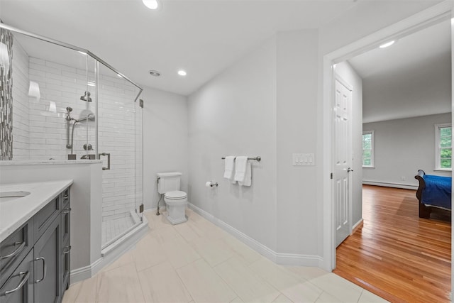 56 Londonderry Ln, Somers, NY 10589 - full bathroom with a shower stall, baseboard heating, toilet, vanity, and baseboards