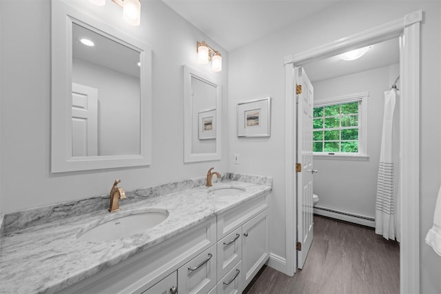 56 Londonderry Ln, Somers, NY 10589 - bathroom with a baseboard heating unit, double vanity, and toilet